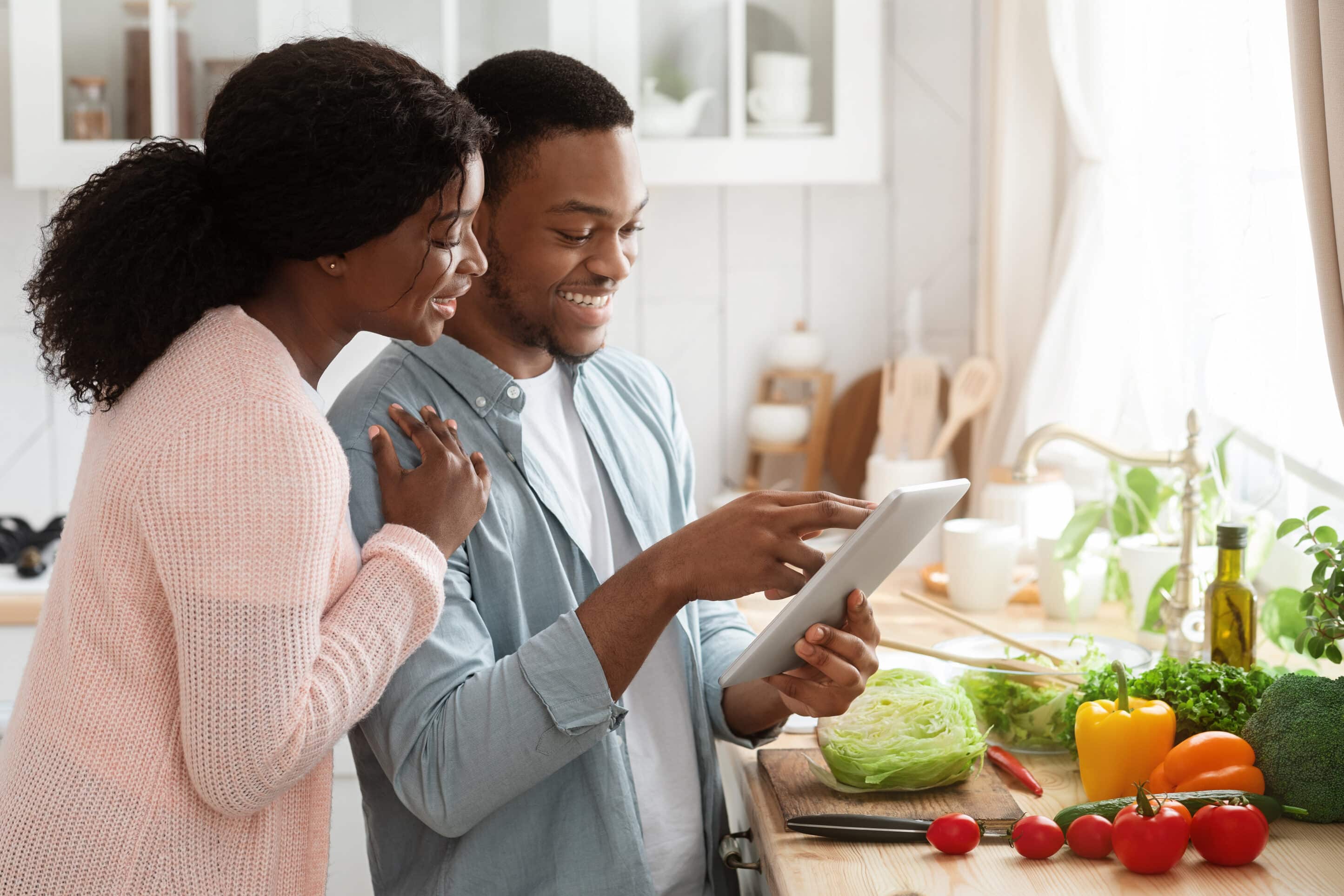 Young couple looking at tablet